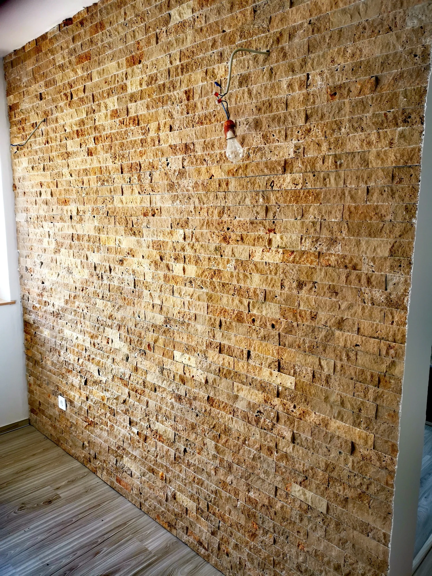 A detail of stone-effect wall tiles.