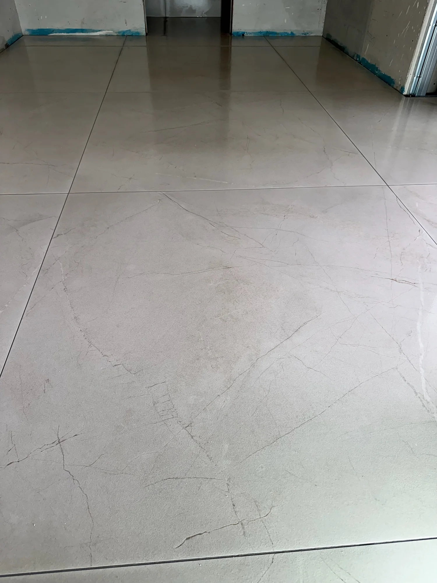 Large-format floor tiles in the District III house.